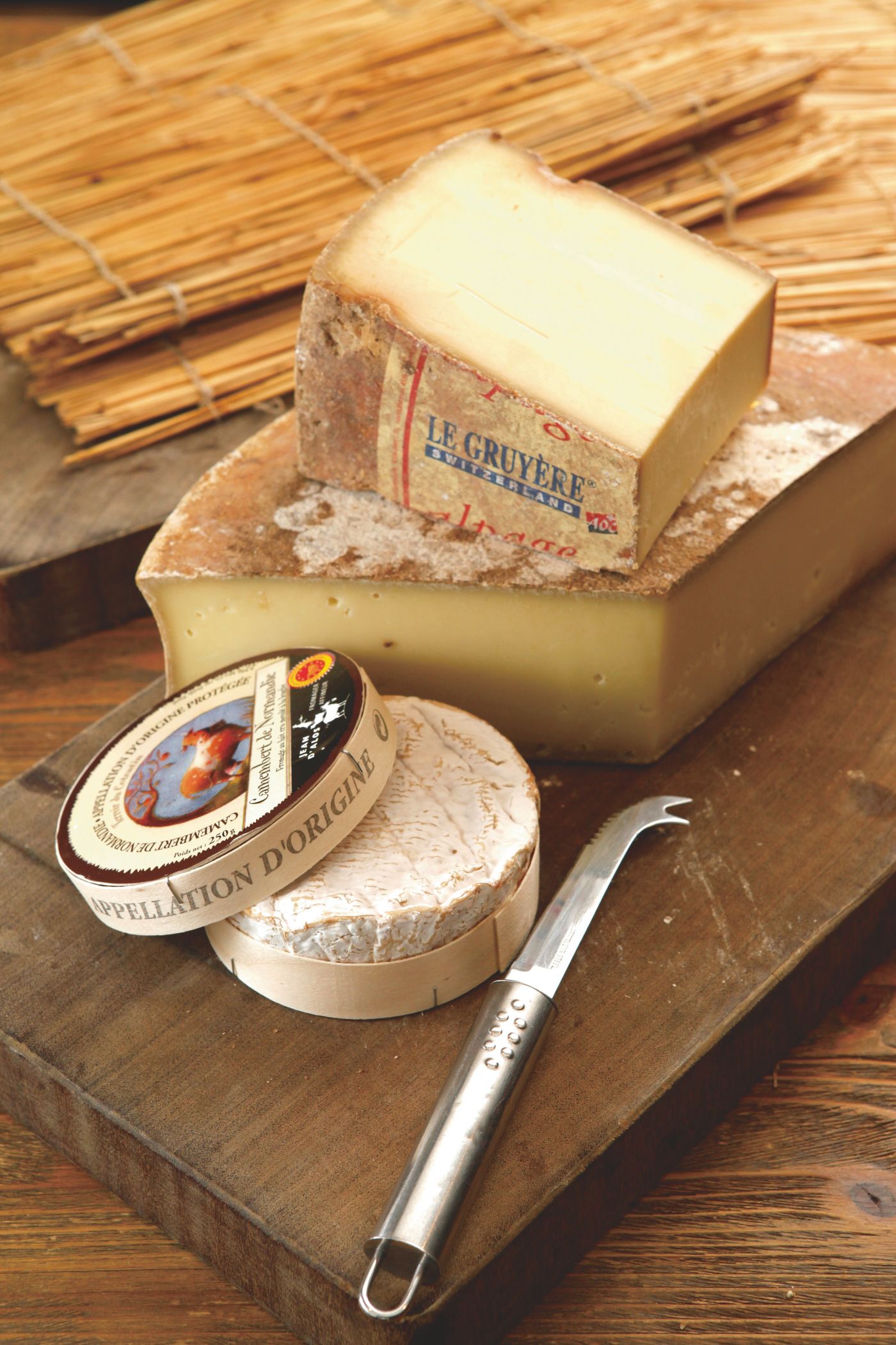 Le Gruyère beside a Camembert de Normandie