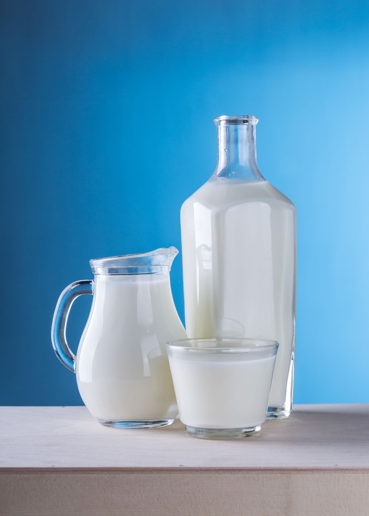 Bottles of milk on a wooden table