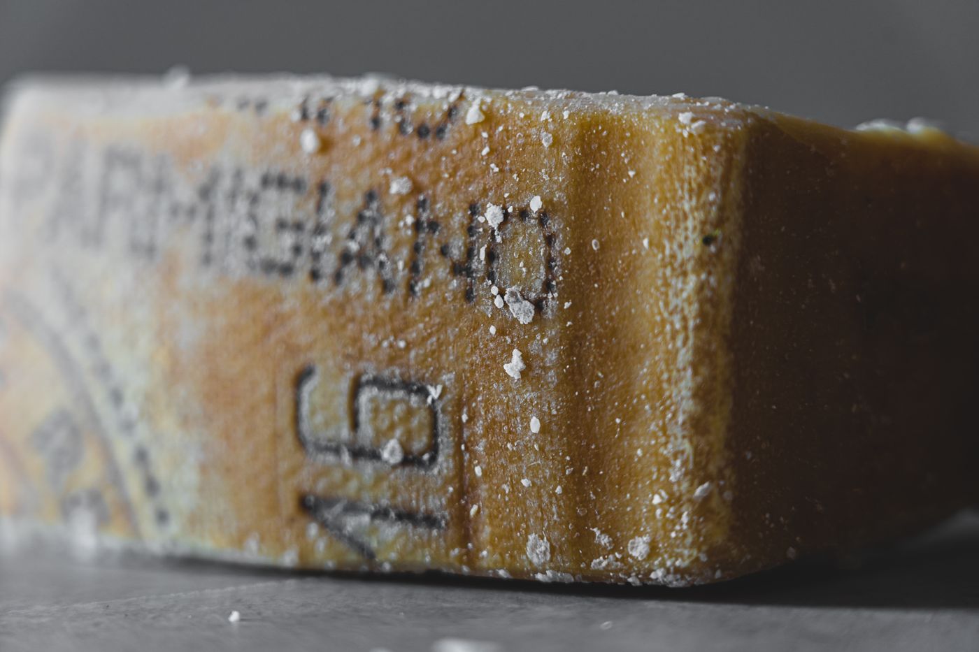 A drier, longer-aged cheese with crystals in the paste