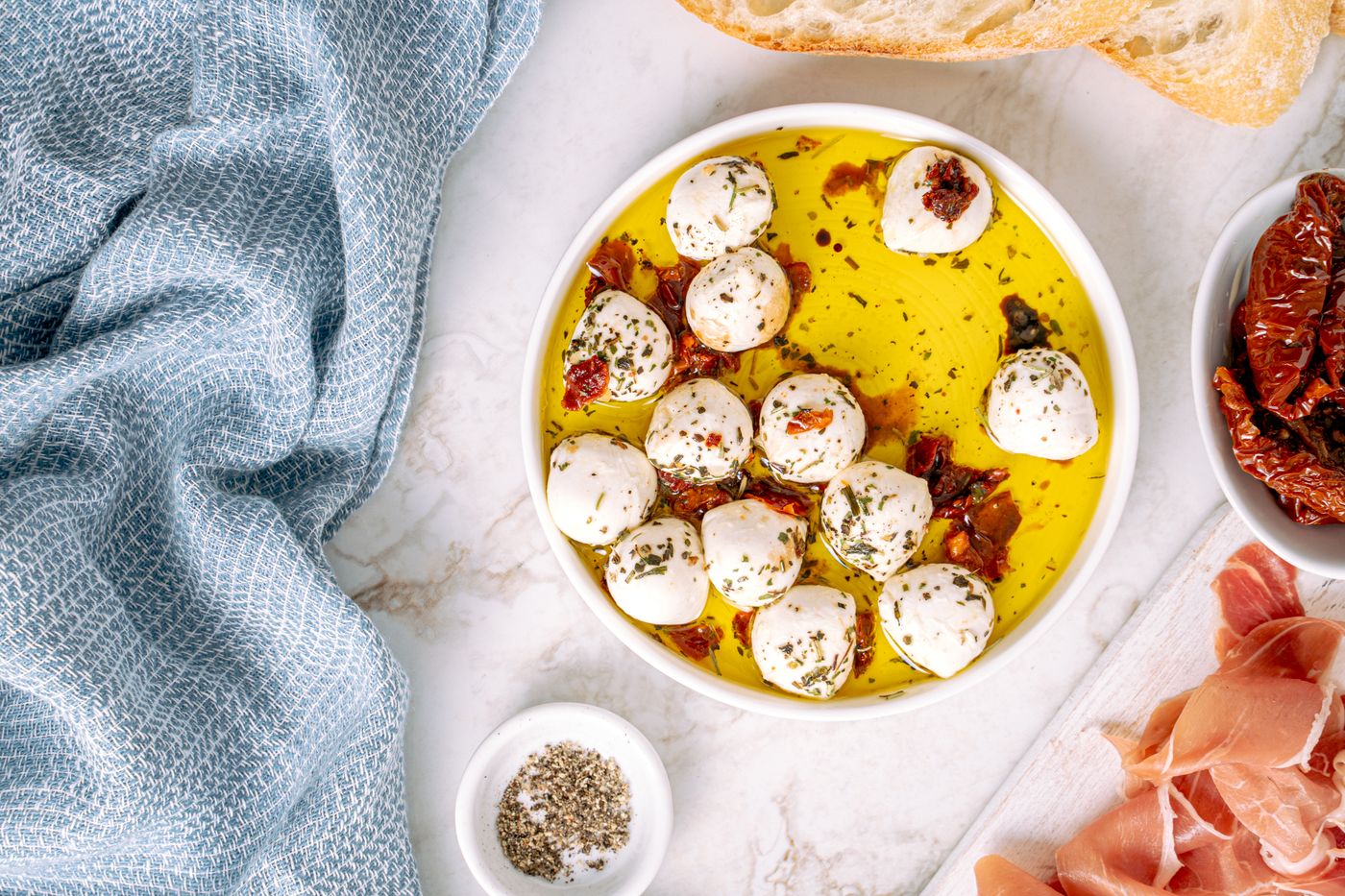 Fresh mozzarella balls in oil with herbs