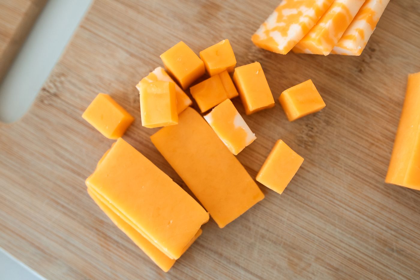 Cheddar-style blocks and cubes on a board