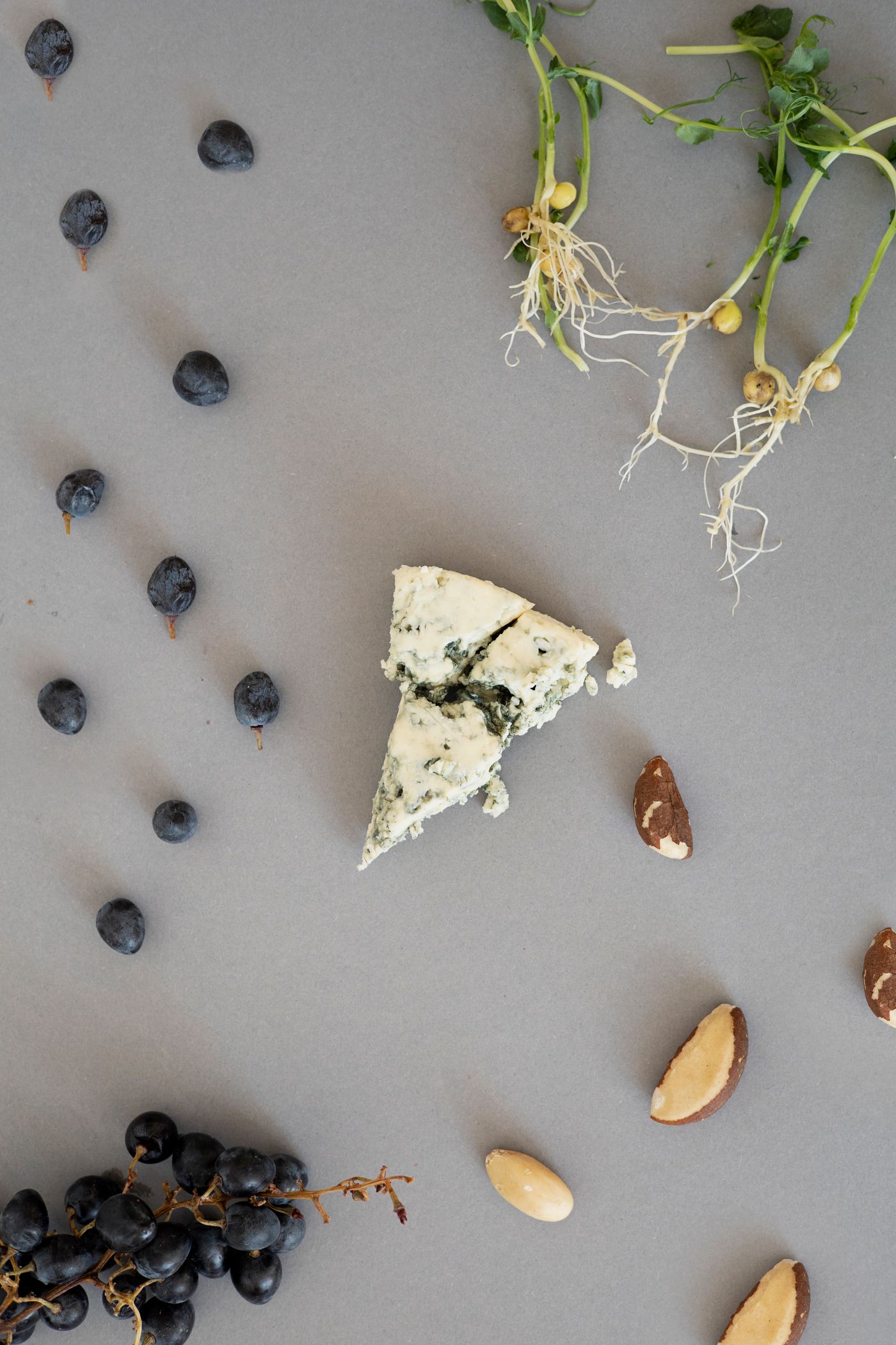 Gorgonzola with grapes, nuts, and herbs