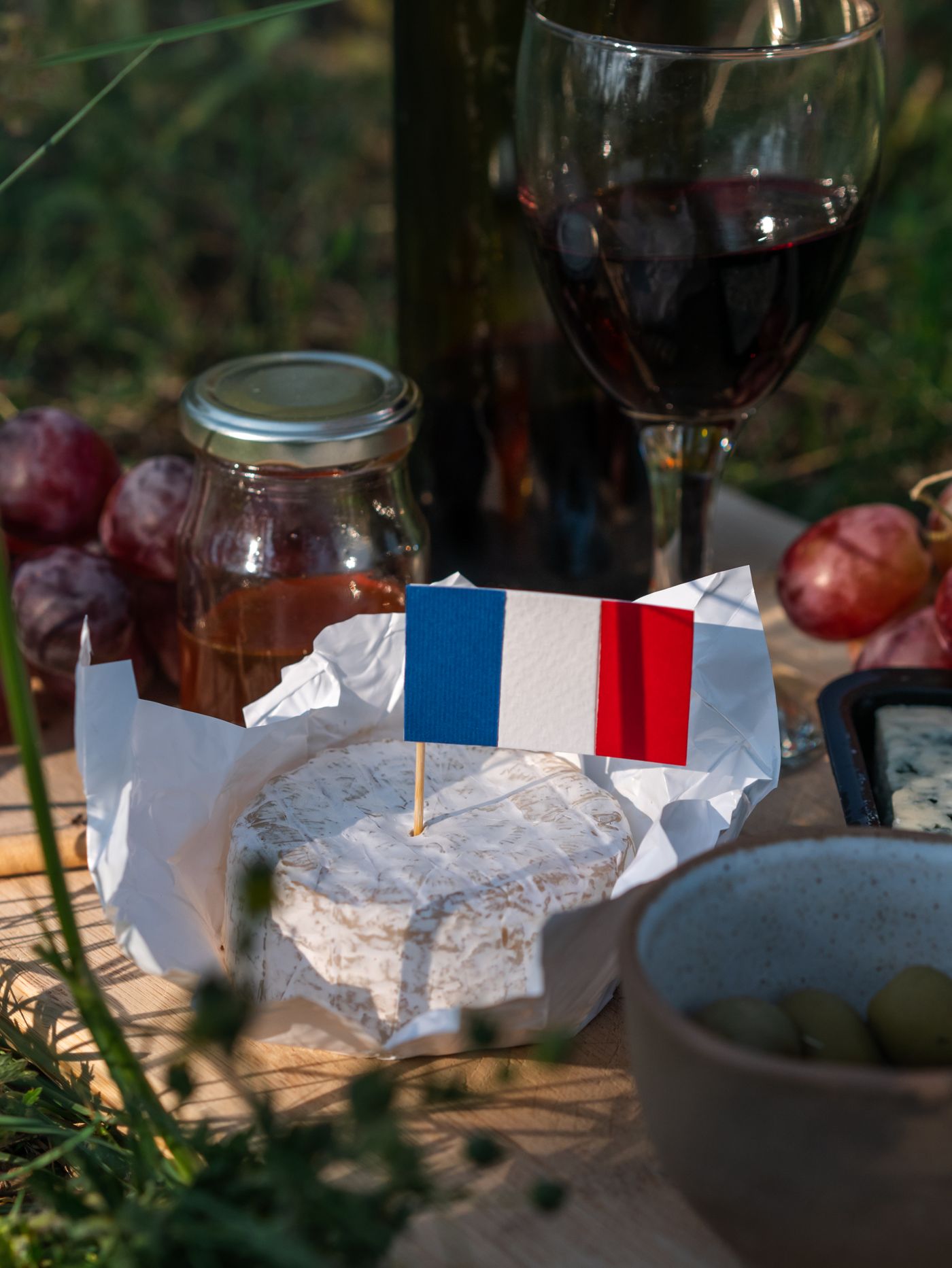 A small Camembert disc with a French flag